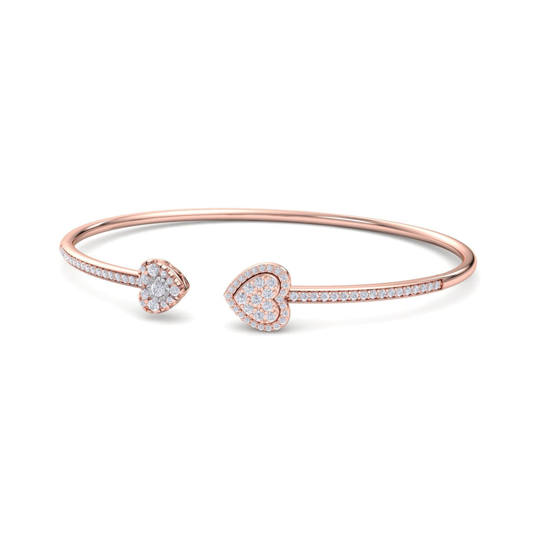 Hearts cuff bracelet in yellow gold with white diamonds of 0.56 ct in weight