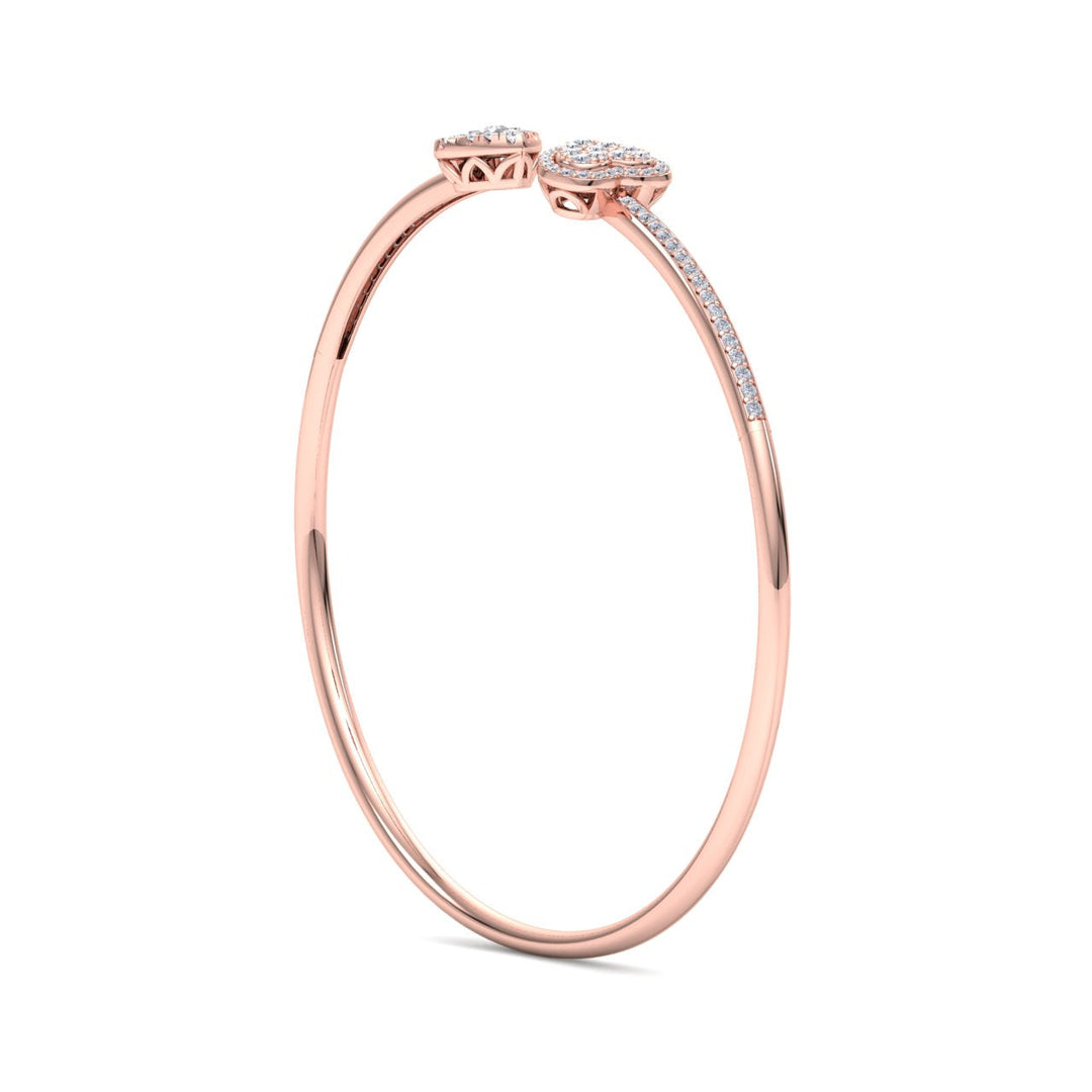 Hearts cuff bracelet in yellow gold with white diamonds of 0.56 ct in weight