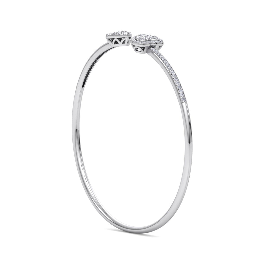 Hearts cuff bracelet in yellow gold with white diamonds of 0.56 ct in weight
