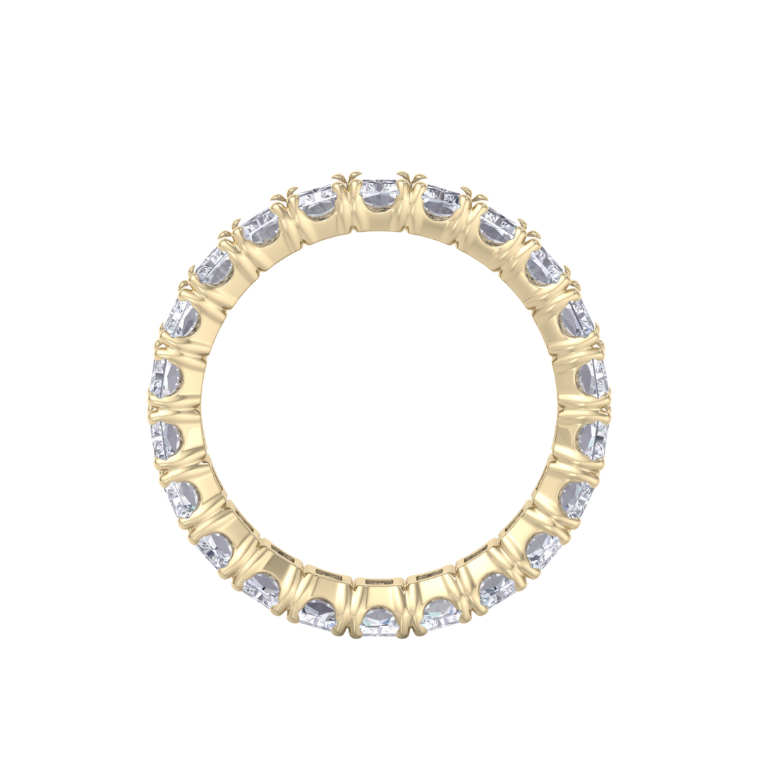 Eternity ring in yellow gold with emeralds white diamonds of 4.18 ct in weight