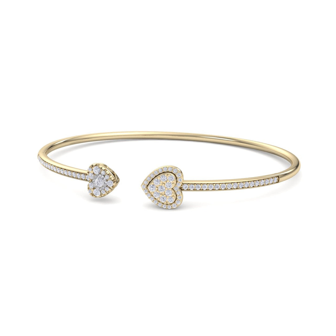 Hearts cuff bracelet in yellow gold with white diamonds of 0.56 ct in weight
