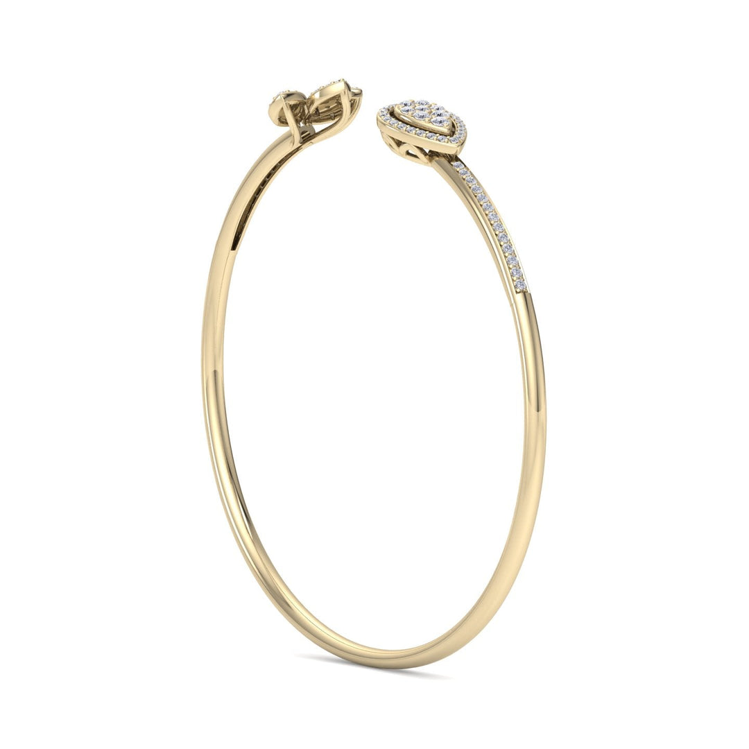 Diamond cuff bracelet in yellow gold with white diamonds of 0.56 ct in weight