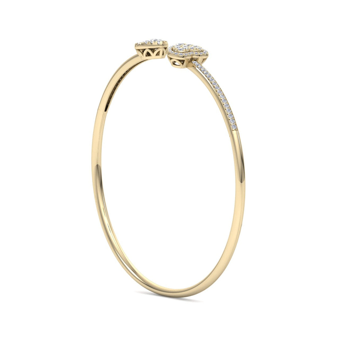 Hearts cuff bracelet in yellow gold with white diamonds of 0.56 ct in weight